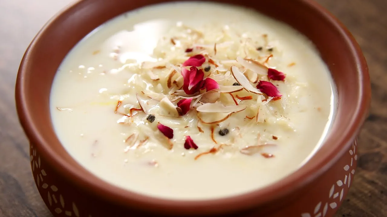 A bowl of rice kheer garnished with nuts